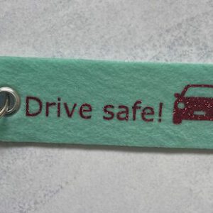 Sleutelhanger drive safe glitter roze